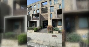 A multi-story residential building with balconies, a central courtyard, and a brick facade. - Radiant 1BDR Retreat with WiFi in North Maida Vale (London)