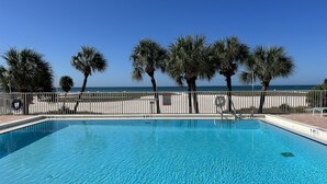A rectangular swimming pool with a white border and a no diving sign. - Paradise on the Beach (Treasure Island)