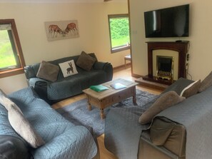 Cottage | Living area | TV, fireplace - Captivating 5-bed Cottage With Private hot tub (Invergarry)