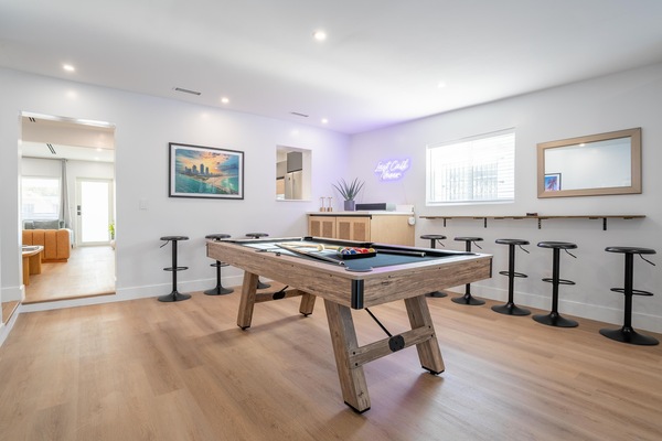 The game room has a billiard pool table & Naim Mu-so music speaker system.