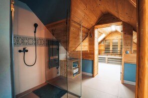Shower, hair dryer, towels, toilet paper