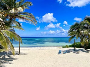 On the beach, sun loungers, beach towels