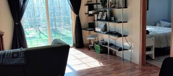 Spacious home with EV charging station two miles from Big Bay Town Park.