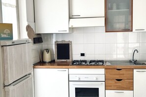 Fridge, oven, dining tables