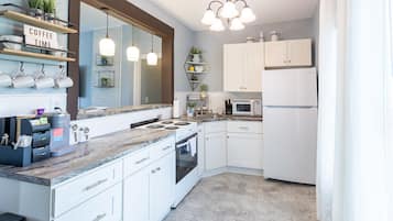 Fridge, microwave, stovetop, coffee/tea maker