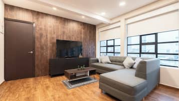 Family Apartment F401 | Living area | 50-inch Smart TV with digital channels, Netflix, streaming services