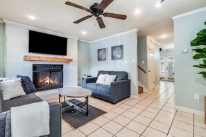Smart TV, fireplace, books