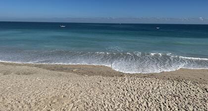 Cosy ground floor apartment in house on a private beach.