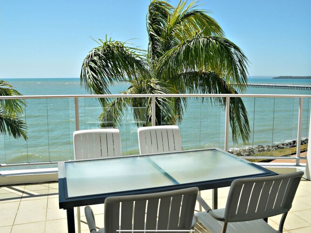 Relax with stunning ocean views from your private balcony, complete with comfortable outdoor seating