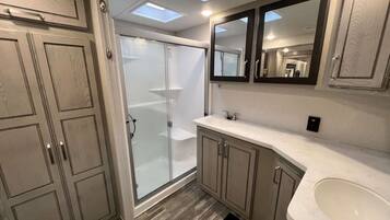 Shower, hair dryer, towels, soap