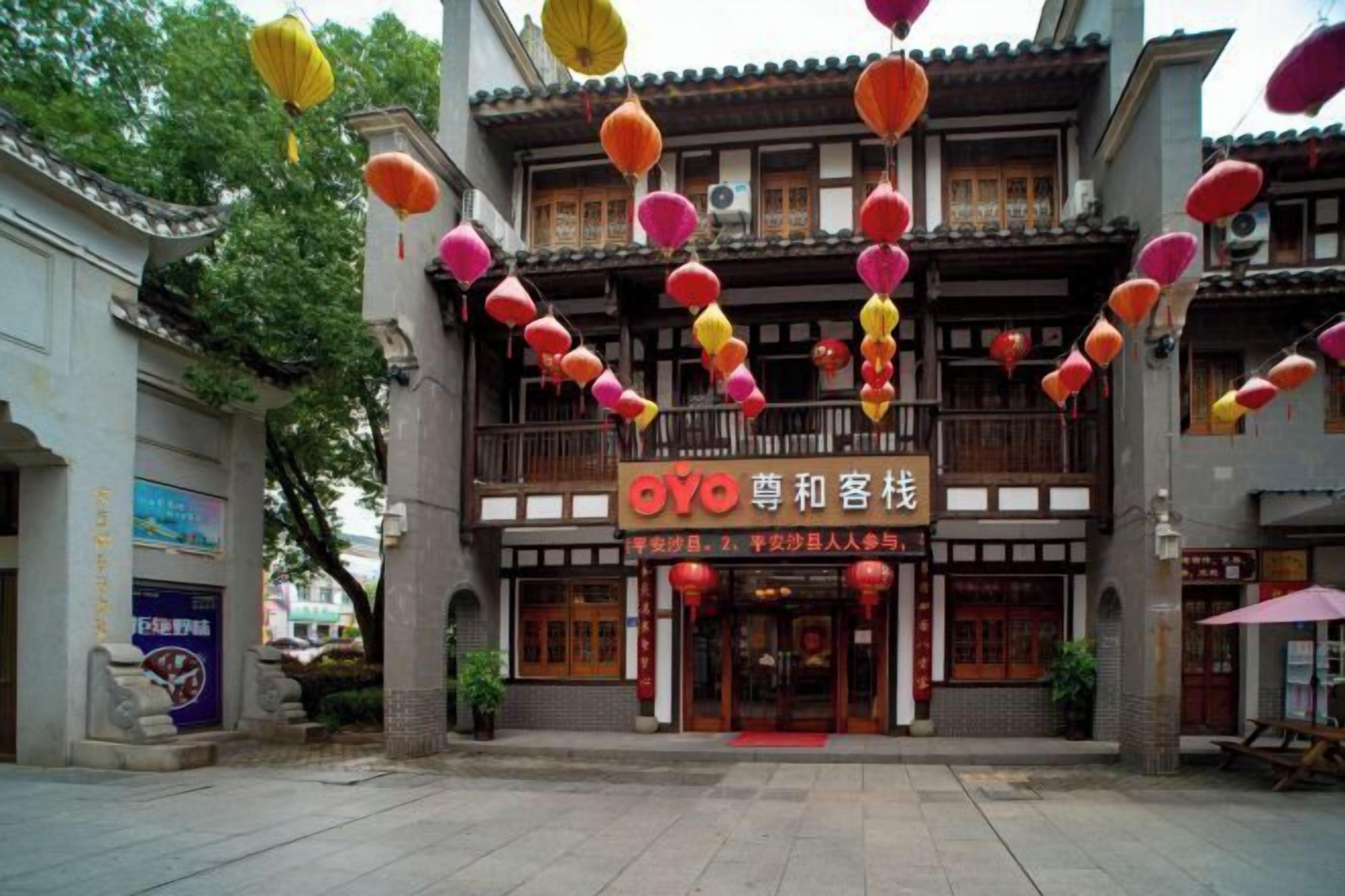 A traditional building with a sign reading "OYO" and Chinese characters.