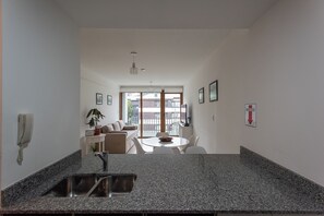 Apartment, 1 Bedroom, Balcony, Mountain View (Amundsen 2) | Private kitchen | Mini-fridge, microwave, oven, stovetop - Gente del Sur - Amundsen (Ushuaia)