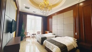 A hotel room with two beds, a TV, a chandelier, and a large window. - Manzhouli Jinlongquan Hotel (Zhayanuoer Museum) (Hulunbuir)