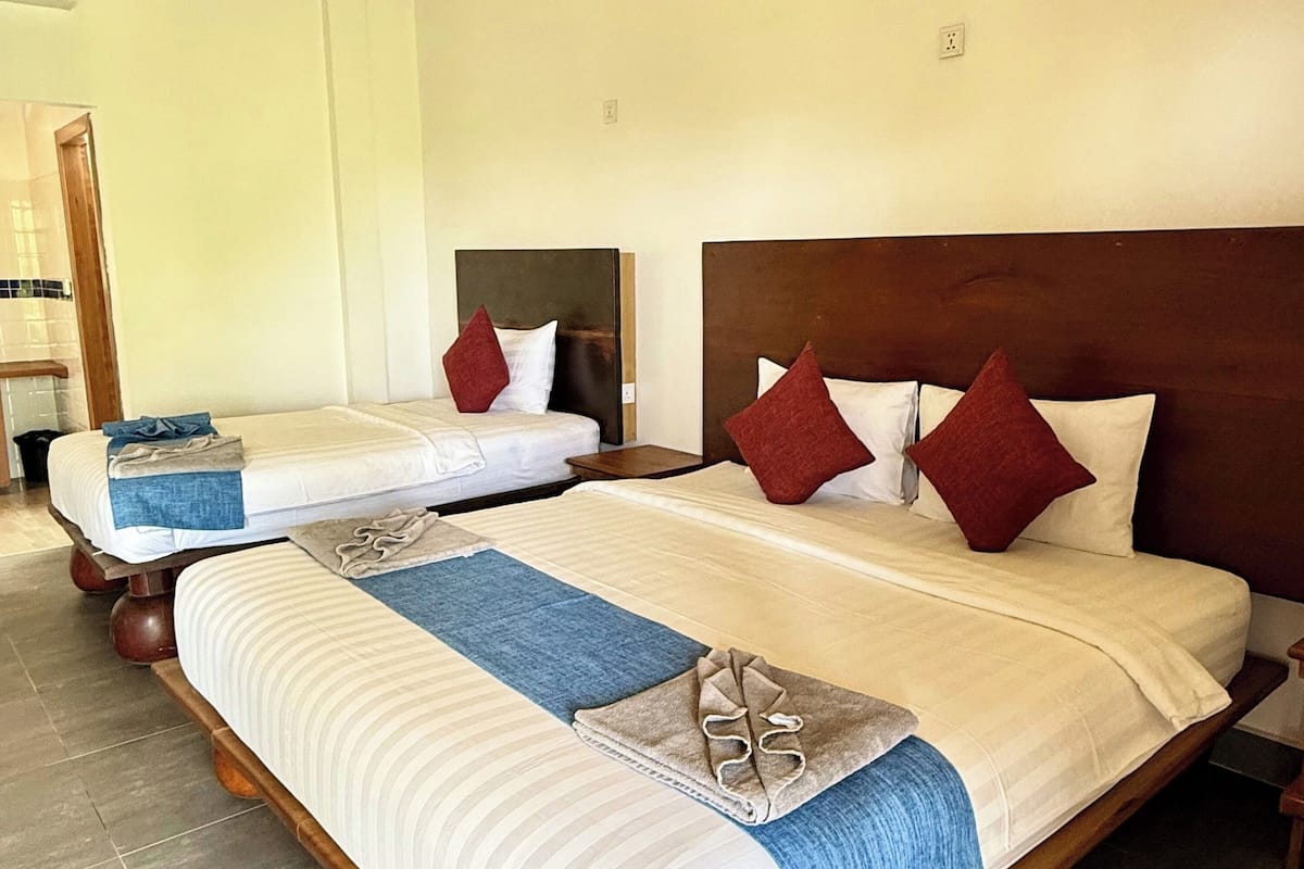 Deluxe Triple Room, 1 Bedroom, Mountain View | 1 bedroom, minibar, in-room safe, bed sheets