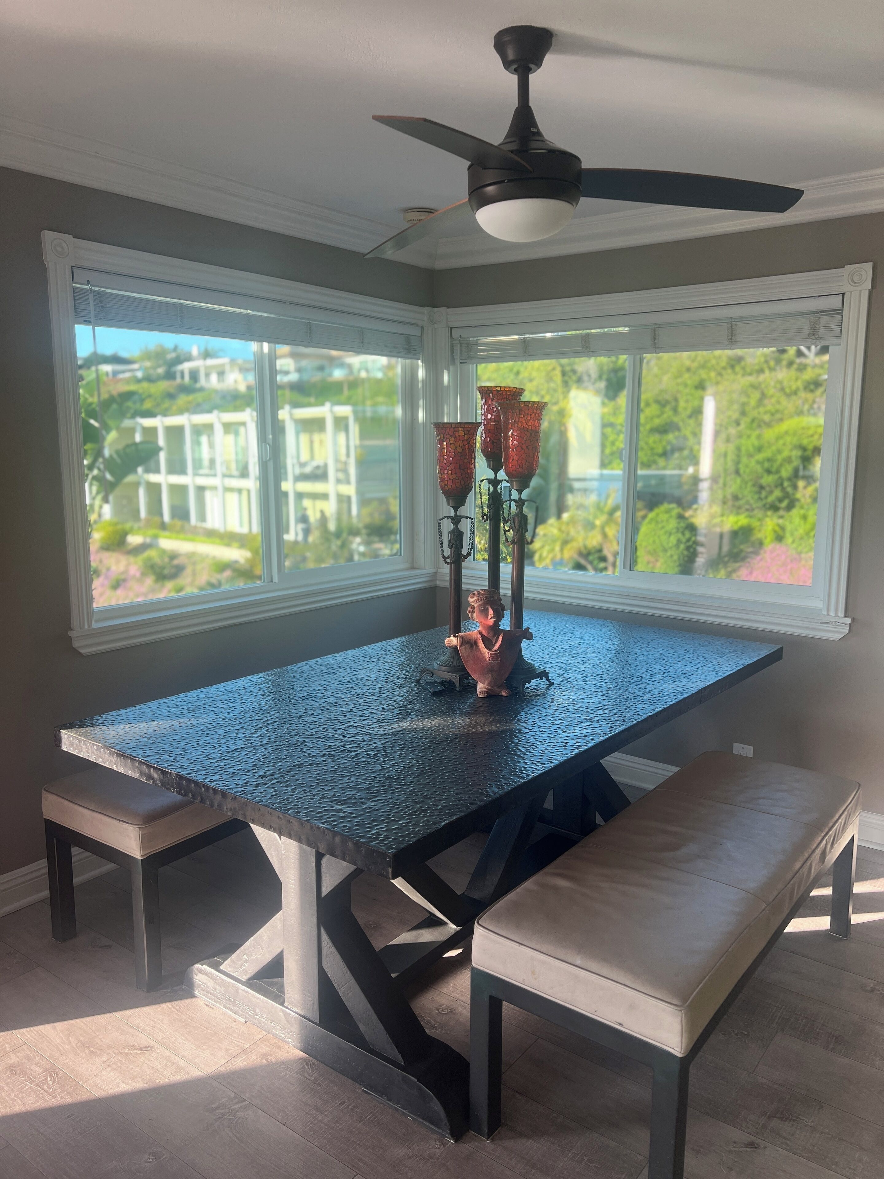 Kitchen table with views of the lush landscape across from the penthouse ! 