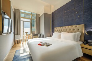 Down comforters, free minibar, in-room safe, desk