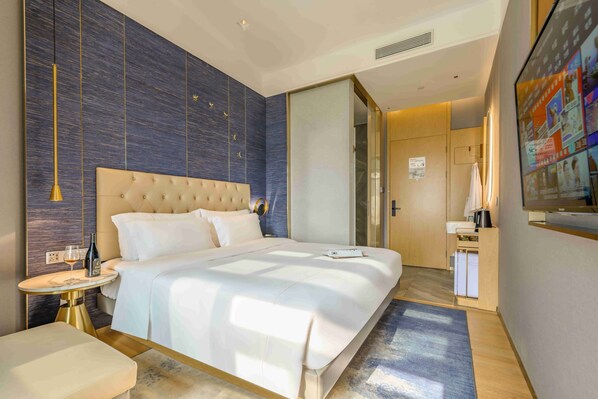 Down comforters, free minibar, in-room safe, desk