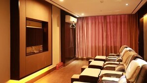 A room with massage chairs, a wall-mounted TV, and a curtain. - Wind bell Hotel (Foshan Guicheng Metro Station) (Foshan)
