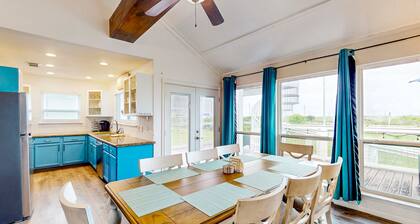 Canal view retreat with vaulted ceilings & three-story observation deck