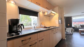 Fridge, microwave, stovetop, coffee/tea maker