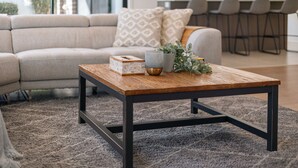 A modern living room with a wooden coffee table, a beige sofa, and a grey rug. - StayAU Newly Cozy Holiday House Tarneit (Tarneit)