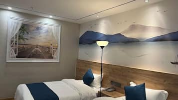 A hotel room with two beds, a nightstand, a lamp, and a mural of a sunset scene.