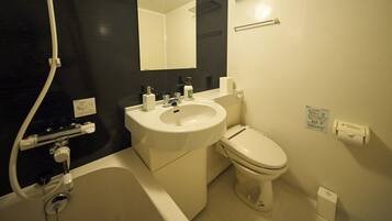 A bathroom with a white sink, toilet, and bathtub. There is a mirror above the sink and a towel rack on the wall.