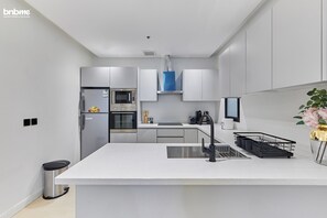 Apartment, 3 Bedrooms, Kitchen | Private kitchen | Coffee/tea maker, electric kettle, dining tables - bnbmehomes - Pvt Rooftop in Al Malqa -C4 (Riyadh)