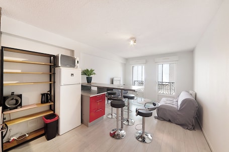 Comfort Apartment, Courtyard View | Living area | 85-cm LED TV with cable channels, Netflix, pay movies