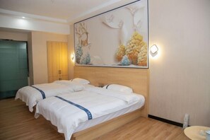 A hotel room with two beds, a large wall mural, and a wooden headboard. - Janger Hotel (Chongqing Nanchuan branch) (Chongqing)