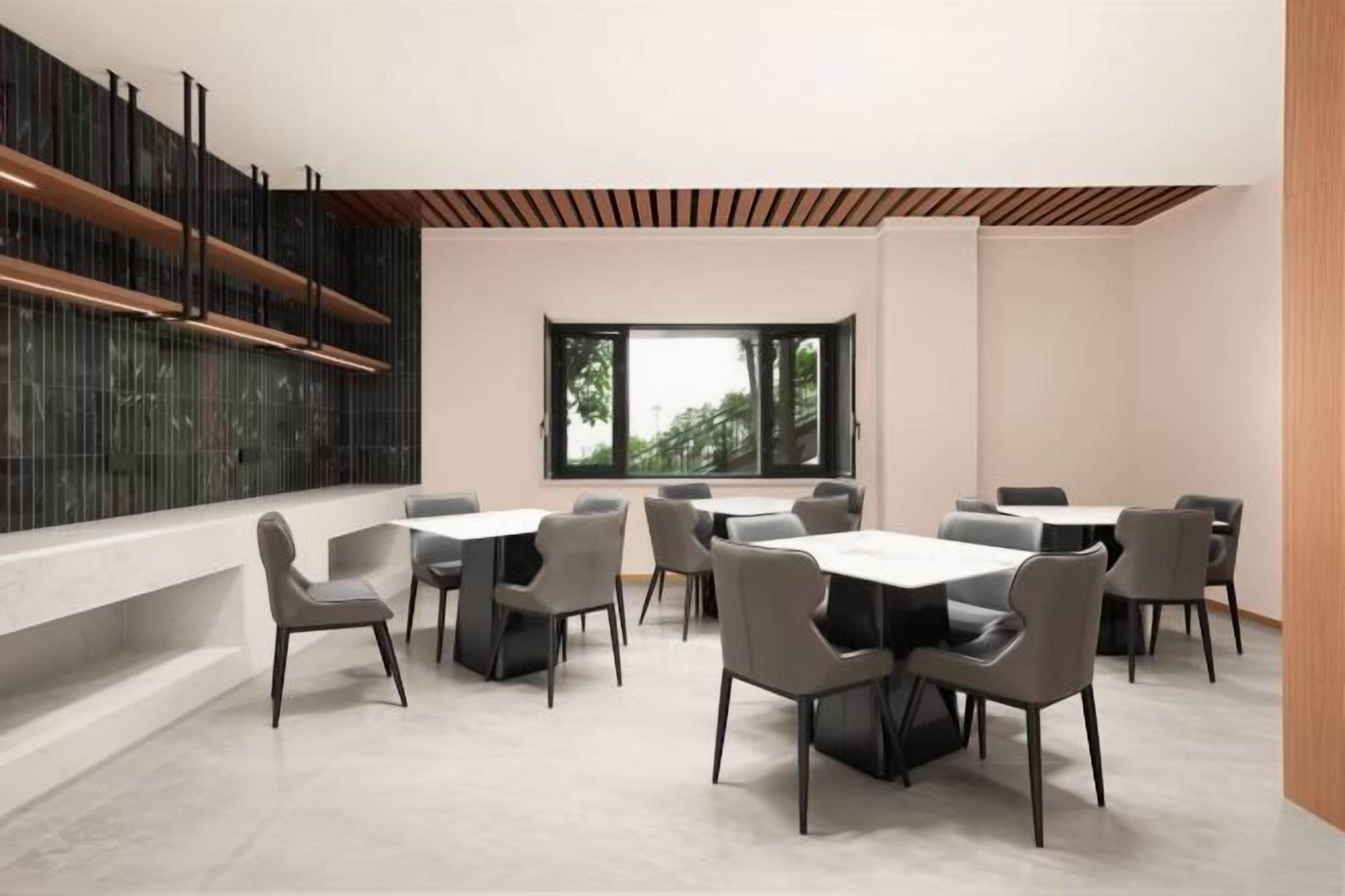 A modern conference room with a long table and chairs, a large window, and a wooden ceiling.