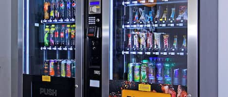 A vending machine with a variety of drinks and snacks.