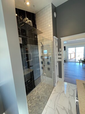 Shower, hair dryer, towels, toilet paper