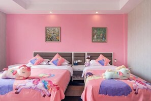 A pink-themed hotel room with two beds, each with a unicorn-themed bedspread and pillows. There are two paintings on the walls and a nightstand between the beds. - Qinshuiwan Holiday Hotel (Ninghai Wujia Manor) (Ninghai)
