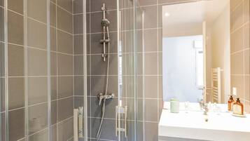 Standard Suite, 1 Bedroom | Bathroom | Shower, rainfall showerhead, hair dryer, towels