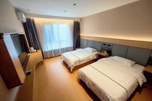 A hotel room with two beds, a desk, a chair, a TV, and a window with curtains. - Mingya Hotel (Bohai International Plaza) (Binzhou)