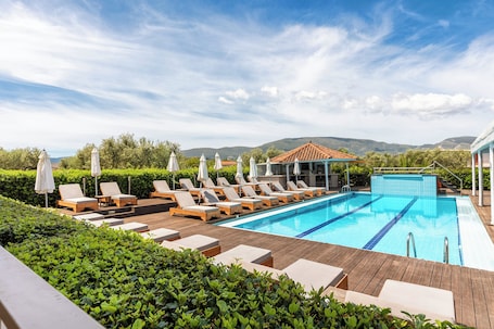 Seasonal outdoor pool, pool umbrellas, sun loungers. Agrilia Hotel - Adults Only