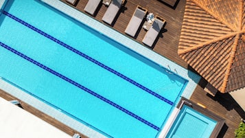 Seasonal outdoor pool, pool umbrellas, pool loungers