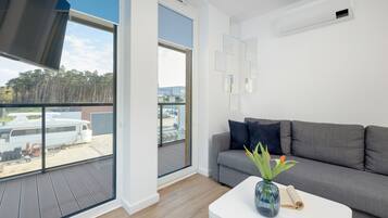 Apartment, 1 Bedroom, Balcony, Beachside | Living room | 36-inch Smart TV with satellite channels