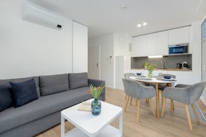 Apartment, 1 Bedroom, Balcony, Beachside | Living room | 36-inch Smart TV with satellite channels - Lighthouse Apartment 1.2 by Renters (Trzebiatow)