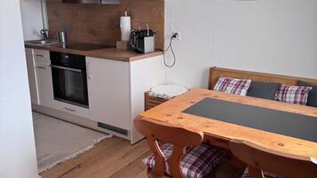 Oven, stovetop, dining tables