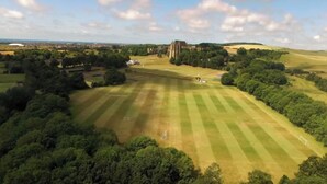 An aerial view of a large, open field with a historic building in the distance. - Seaview 2 Bedroom House Sleeps 4 - Pets Ok -wifi (Shoreham-by-Sea)