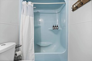 Shower, hair dryer, towels, shampoo