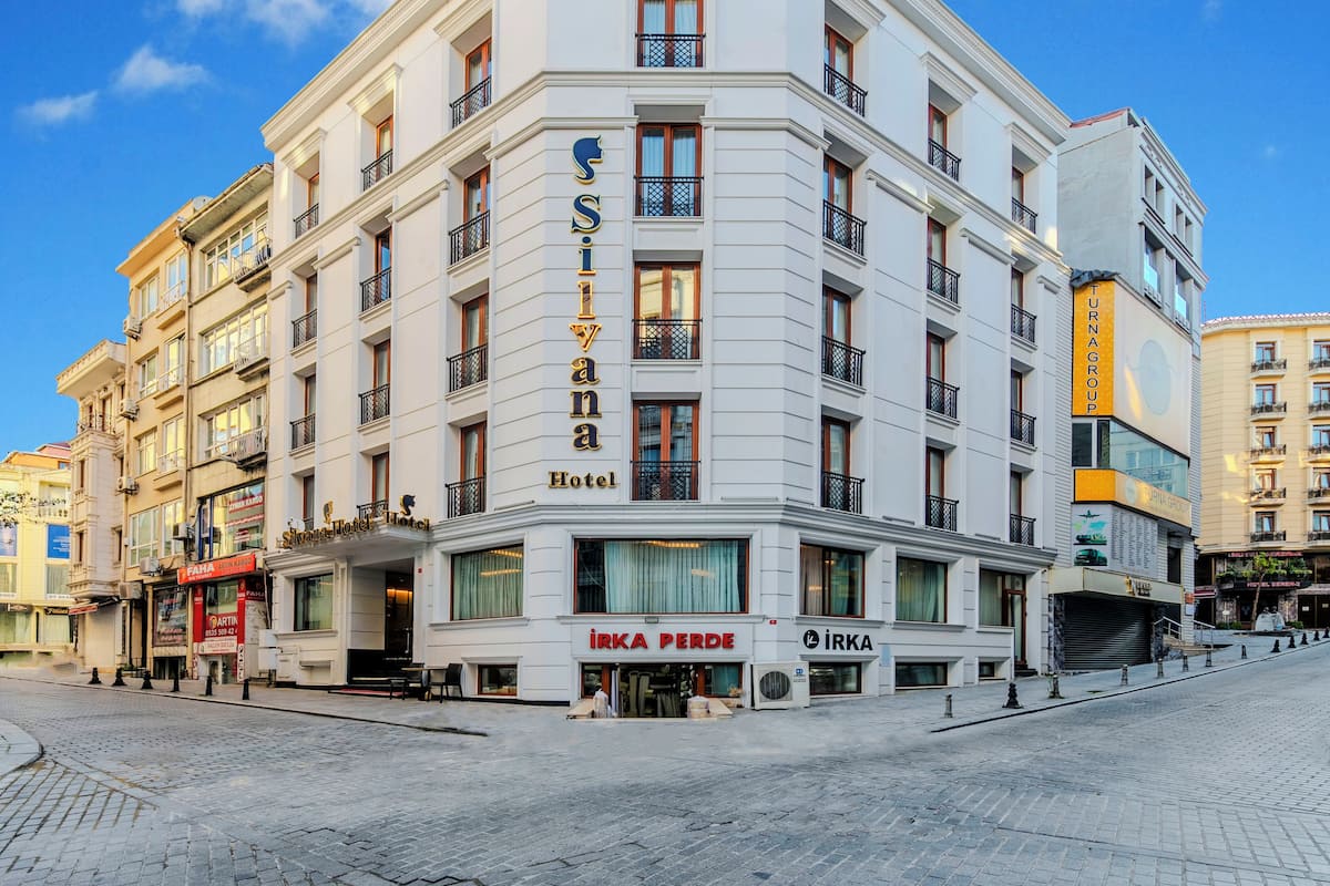 A corner building with a prominent sign for 'Silvana Hotel'.