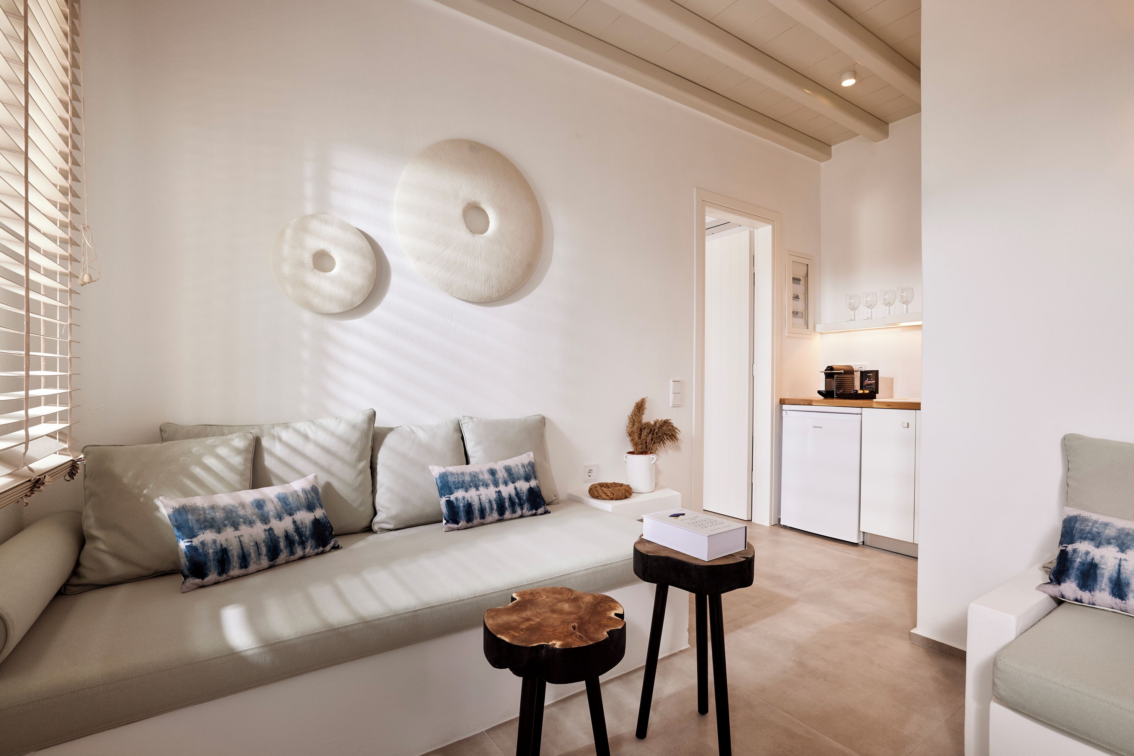 A modern living room with a sofa, coffee table, and decorative wall art.