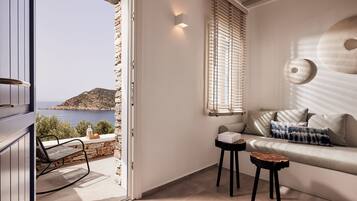 Junior Suite With Sea View | Living area | 45-inch Smart TV with digital channels