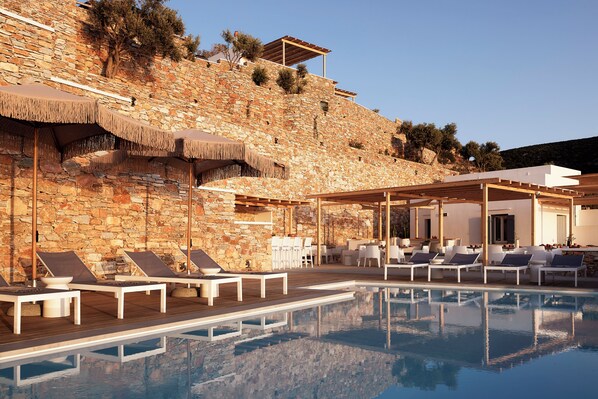 Seasonal outdoor pool, pool umbrellas, pool loungers