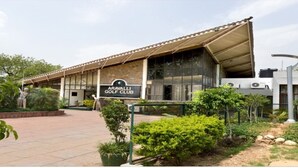 A building with a sign reading "Aravalli Golf Club." - Aravalli Golf Course (Faridabad)