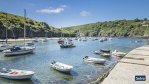 A marina with various boats docked, surrounded by lush green hills. - 19 St Brides Bay, Holiday Apartment Broad Haven, Sleeps 6, 3 bedrooms,  bathrooms (HAVERFORDWEST)