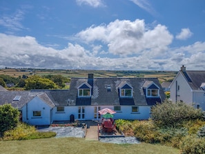 A residential property with a garden patio, a view of the countryside, and a clear sky. - Bryngarw, Holiday Home Trefin, Sleeps 12, 6 bedrooms,  bathrooms (Haverfordwest)